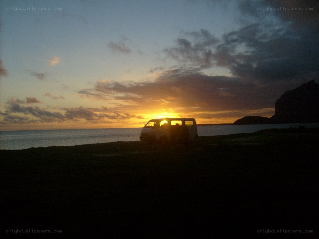 Van at sunset by the sea