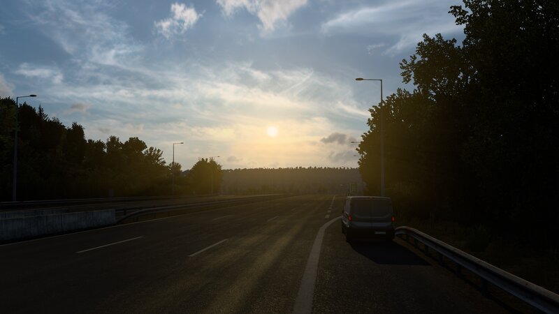 Van on Highway at Sunset