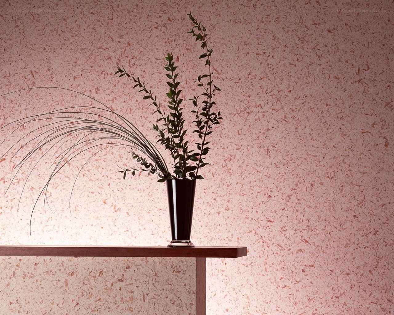 Vase with greenery on shelf