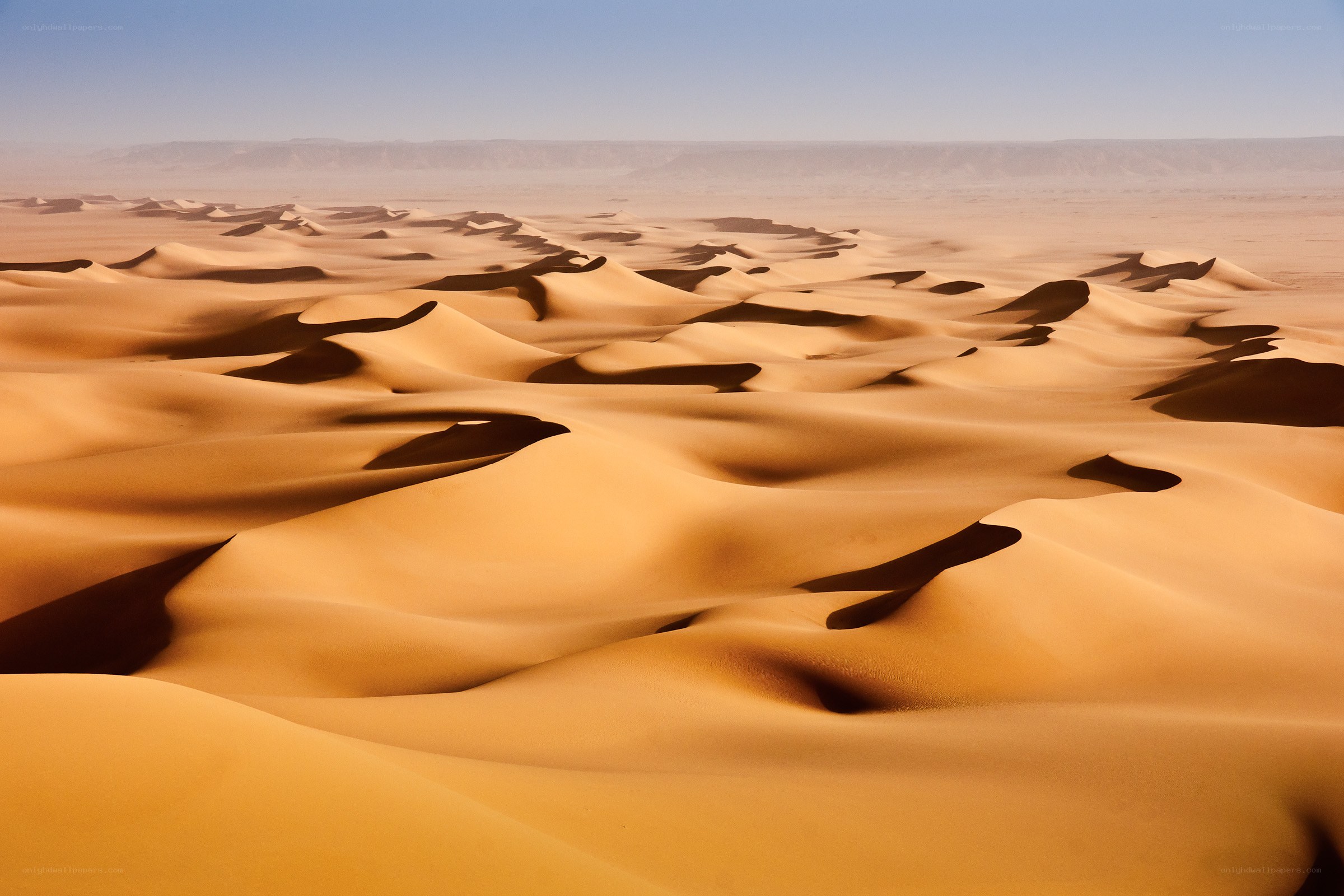 Vast desert sand dunes