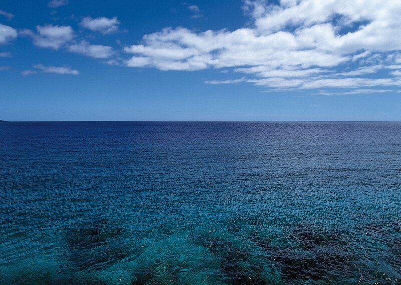 Vast ocean under blue sky