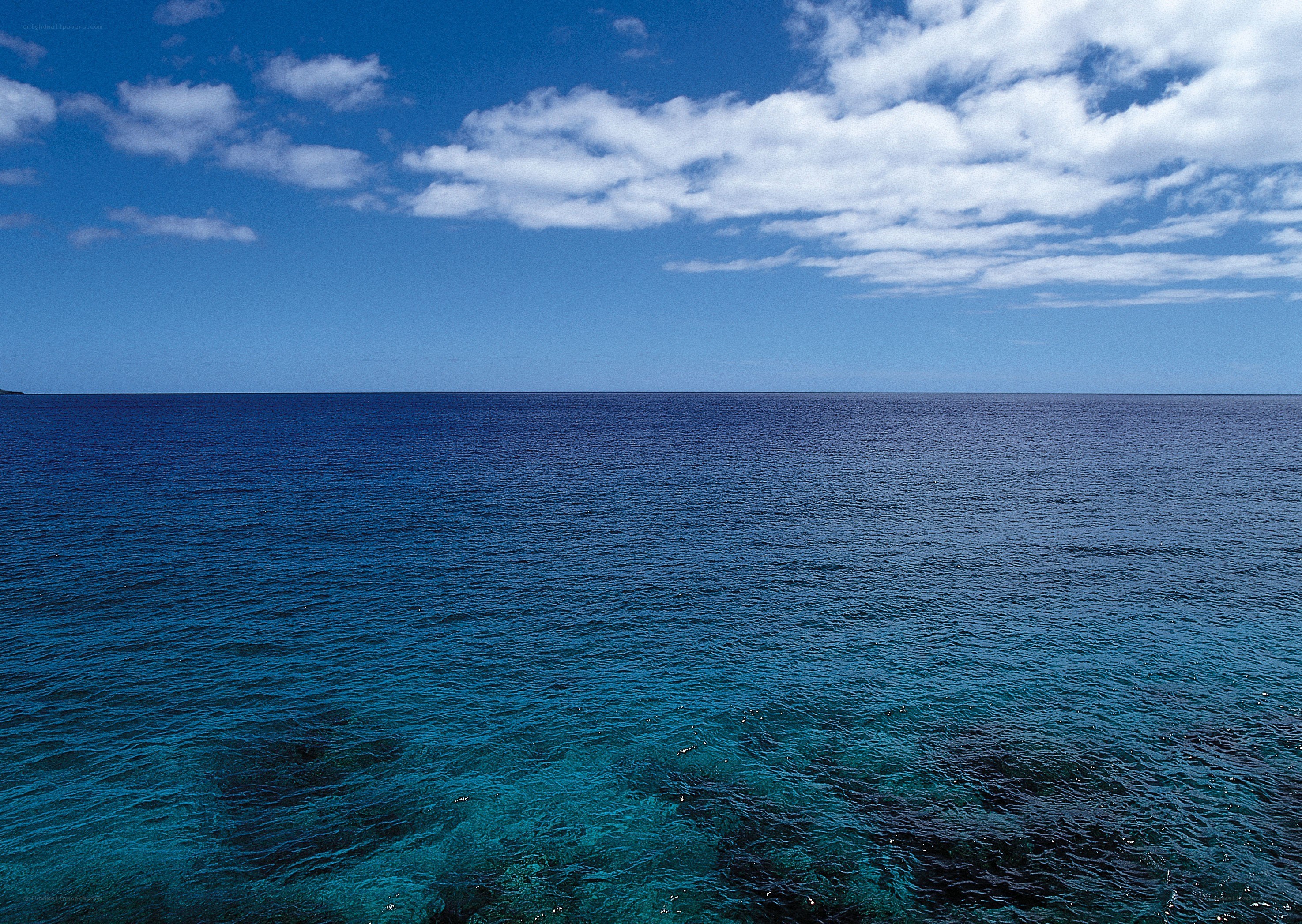 Vast ocean under blue sky