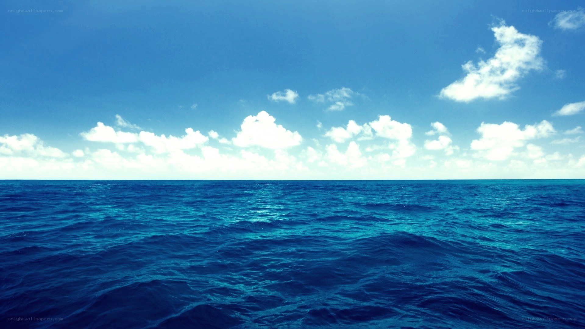 Vast ocean under blue sky