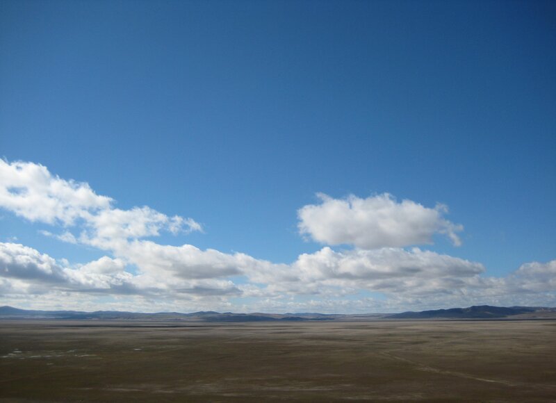 vast plain under blue sky