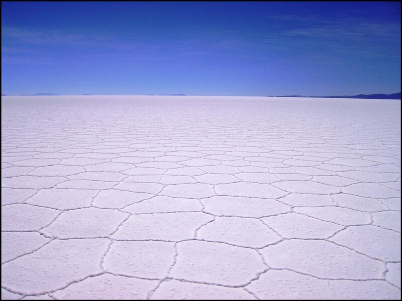 vast salt flat under blue sky