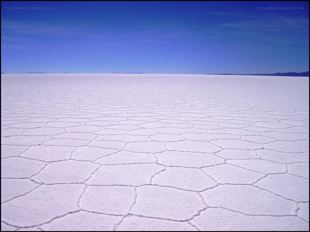 vast salt flat under blue sky
