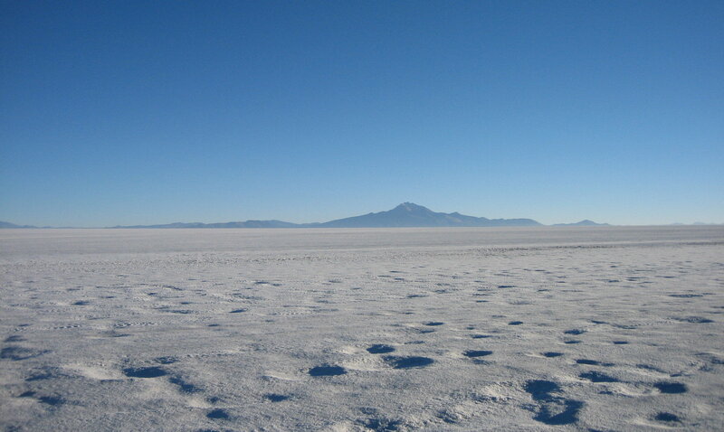 vast salt flat with mountain