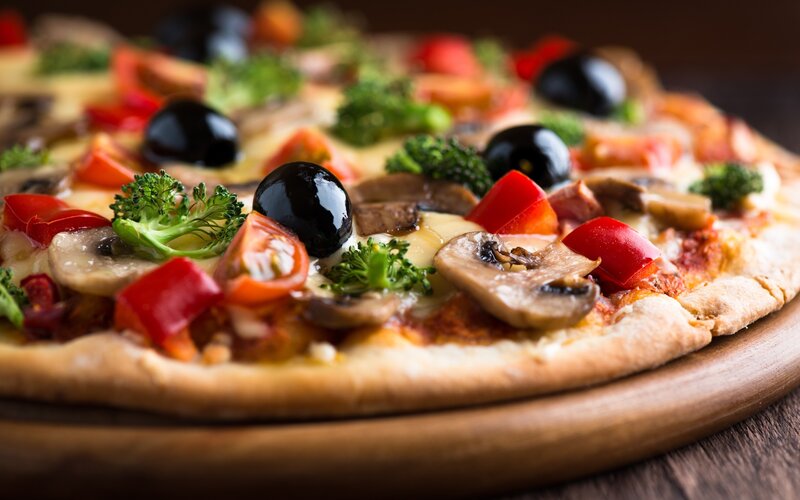 vegetable pizza on wooden board