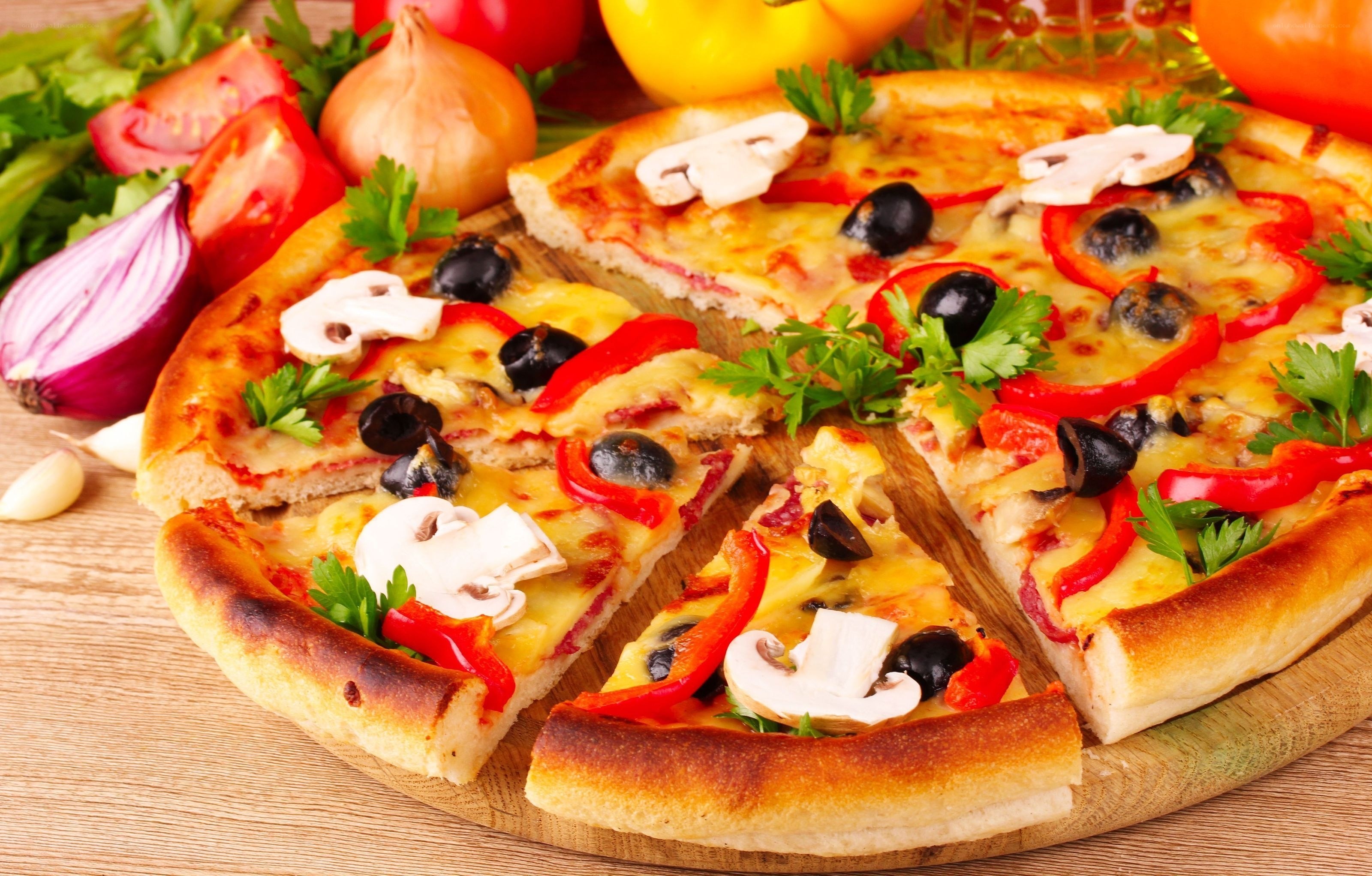 Vegetable pizza on wooden board