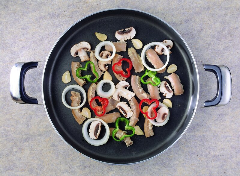 vegetables and meat in a pan