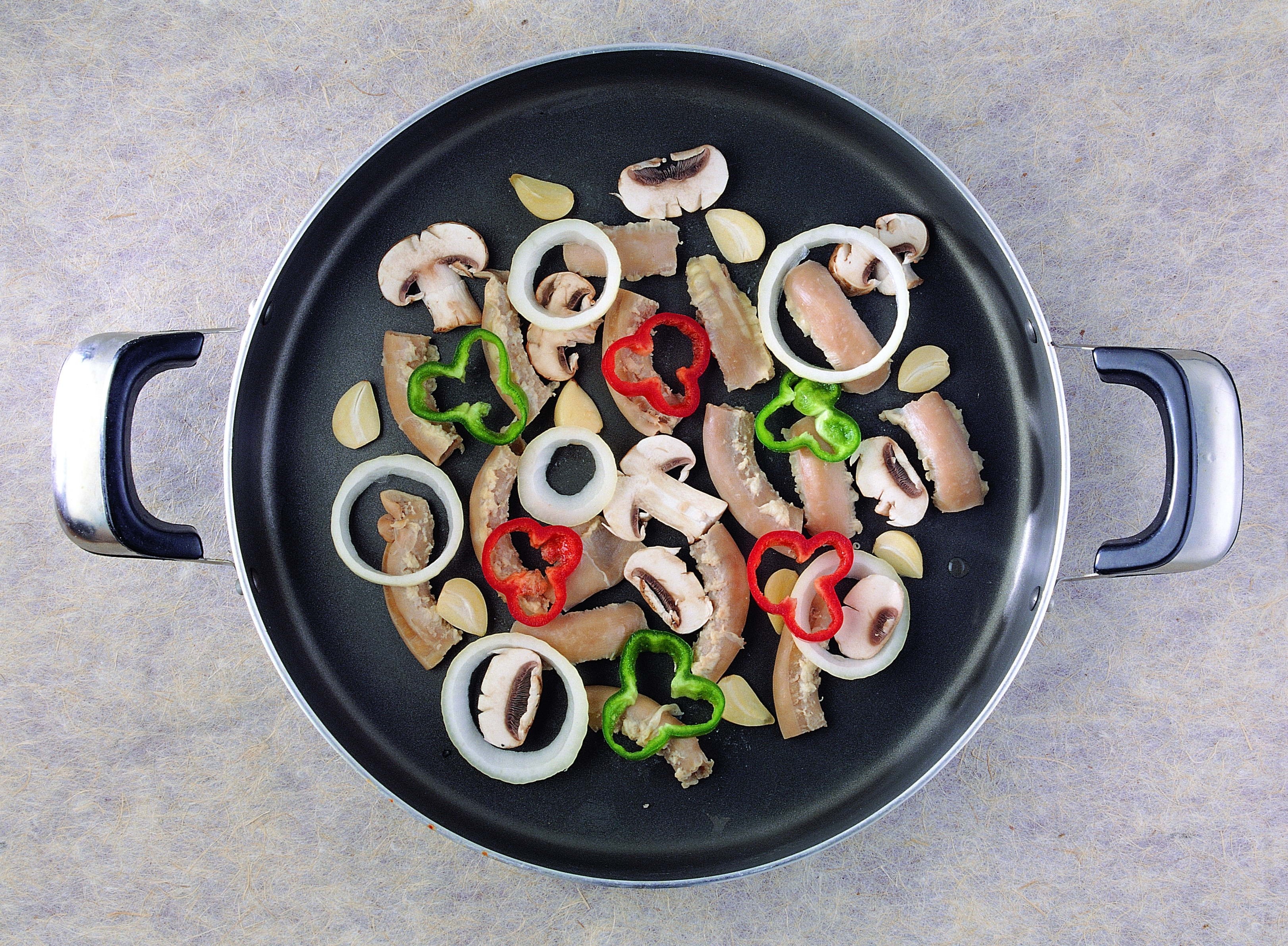 vegetables and meat in a pan