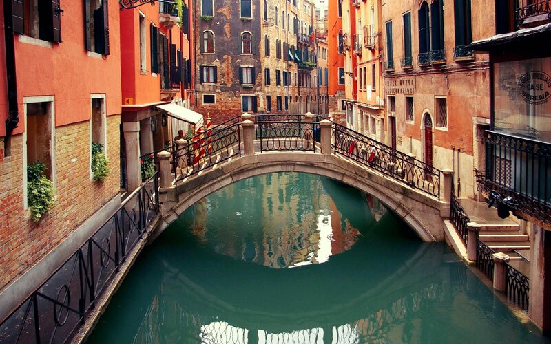 Venetian canal with arched bridge