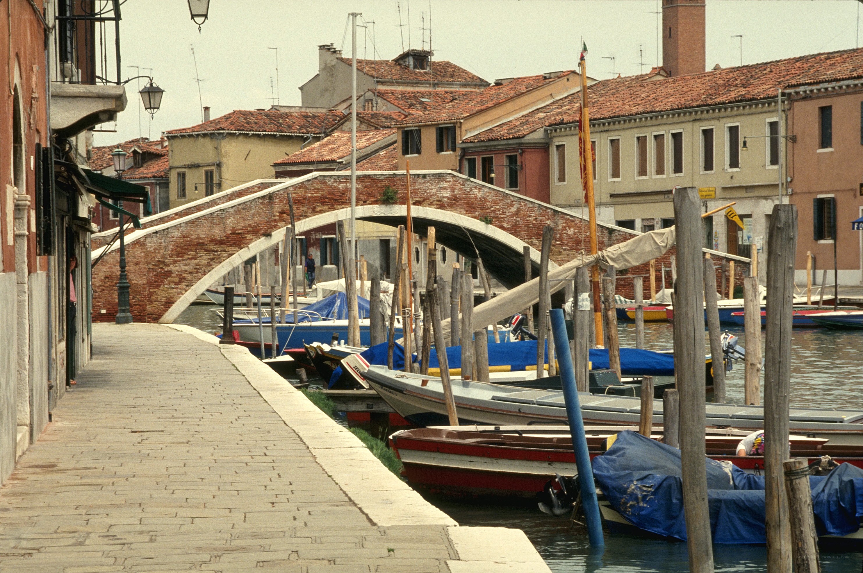 Venetian canal with brick bridge