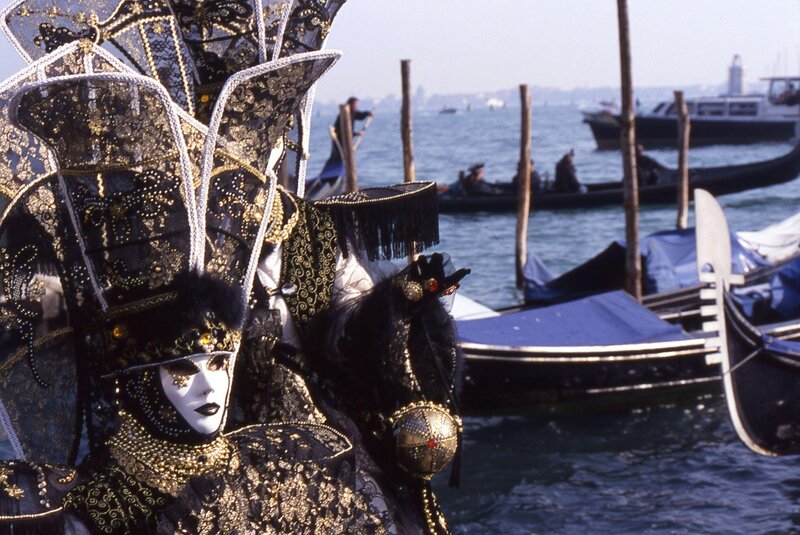 Venetian carnival mask by the canal
