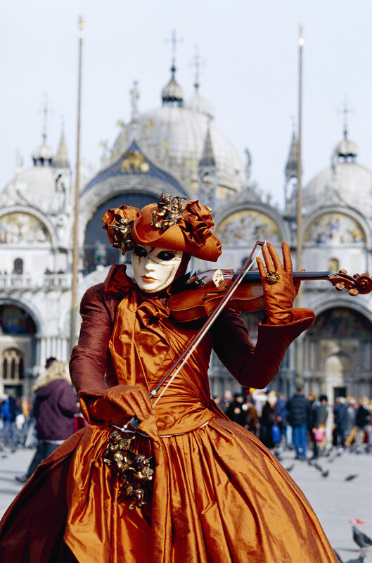 Venetian mask musician