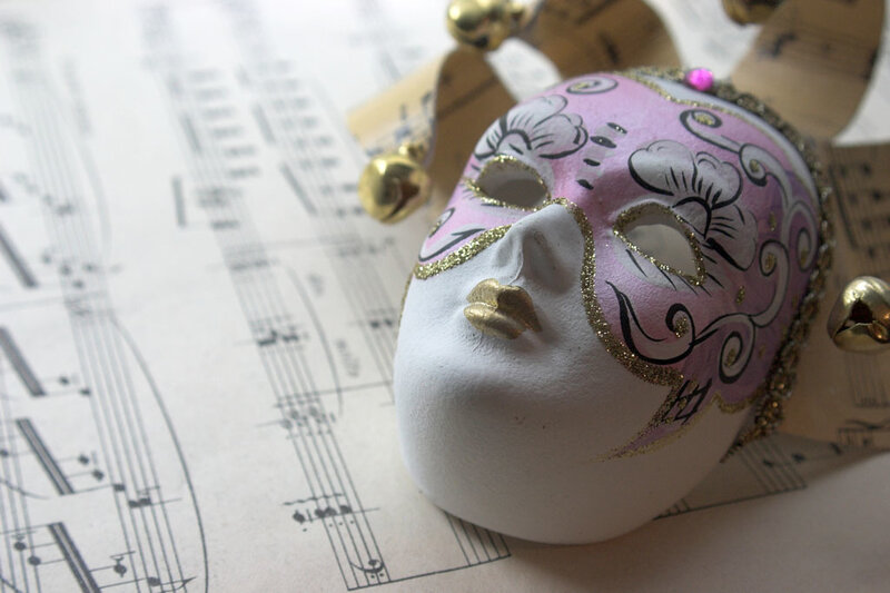 Venetian mask on sheet music