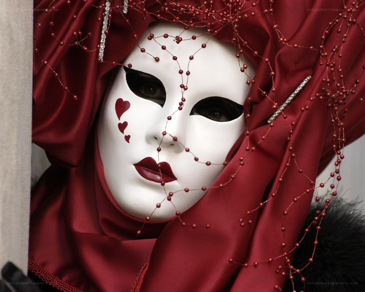Venetian mask with red veil