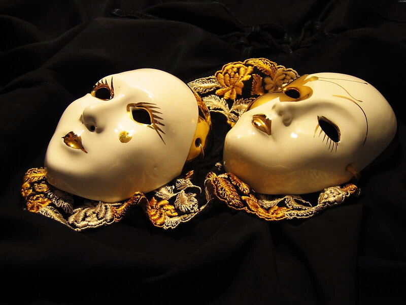 Venetian masks on black fabric