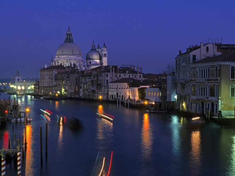 Venice at dusk with illuminated domes