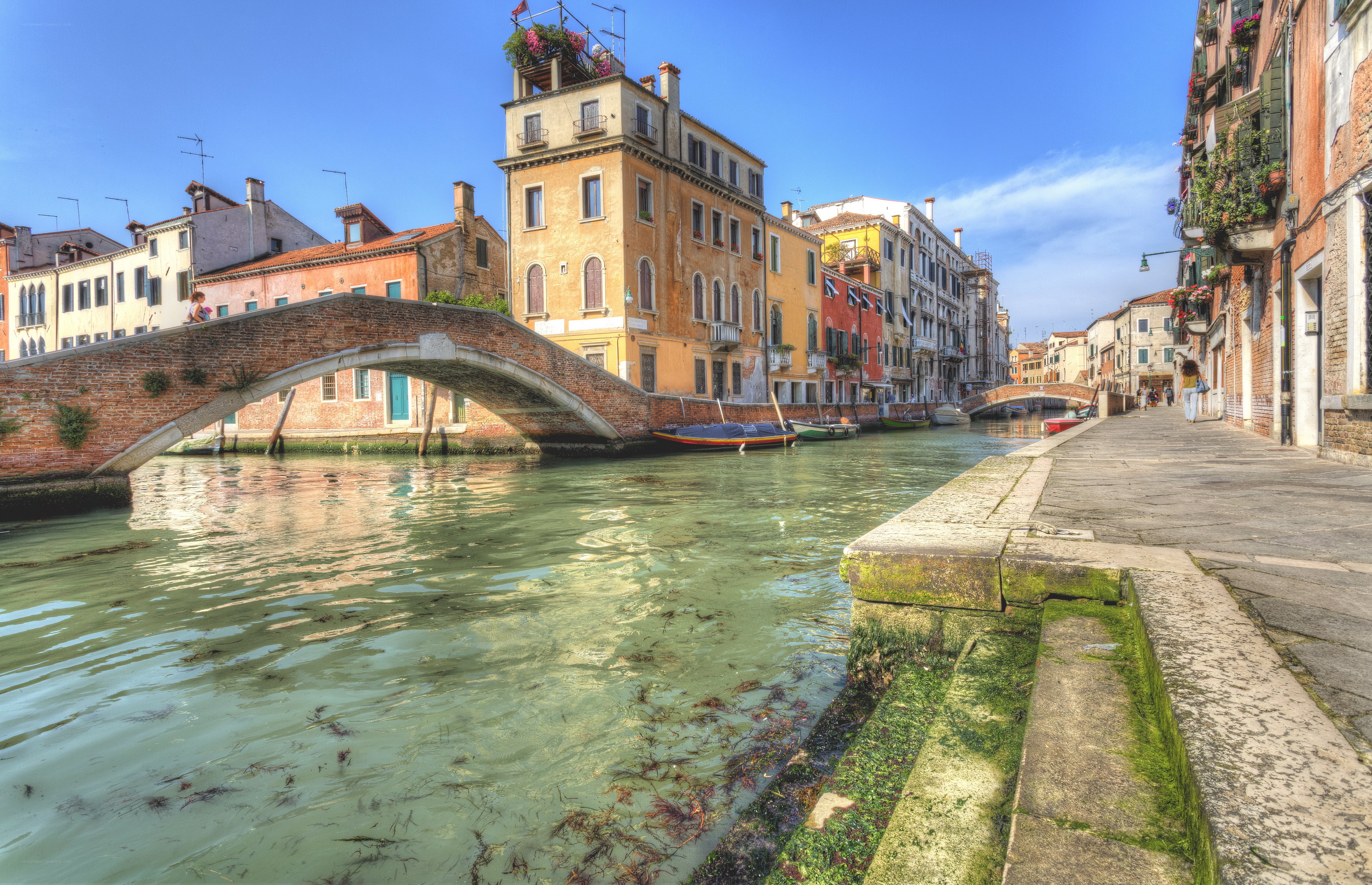 Venice canal with arched bridge