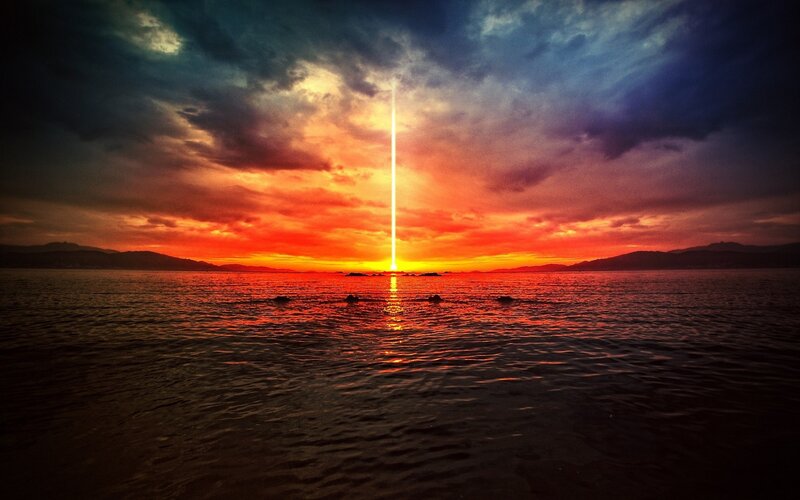 Vertical Light Beam over Sea — Red