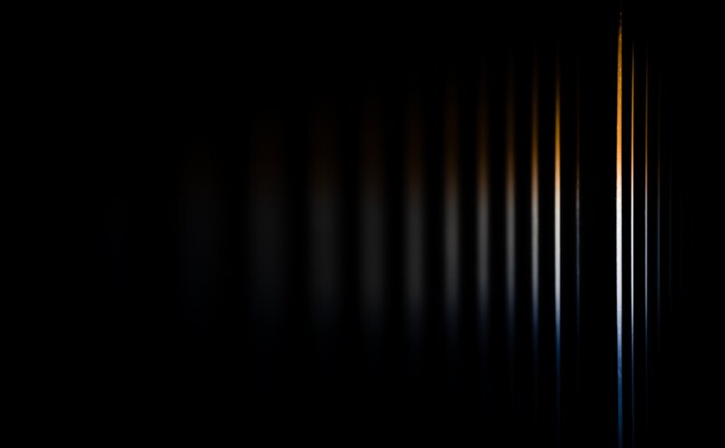 vertical light streaks in darkness