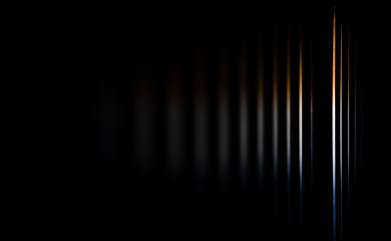 vertical light streaks in darkness