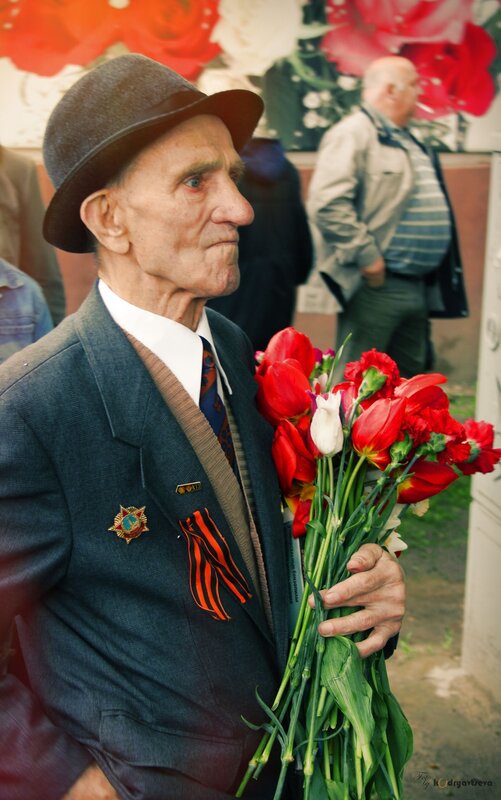 Veteran holding flowers