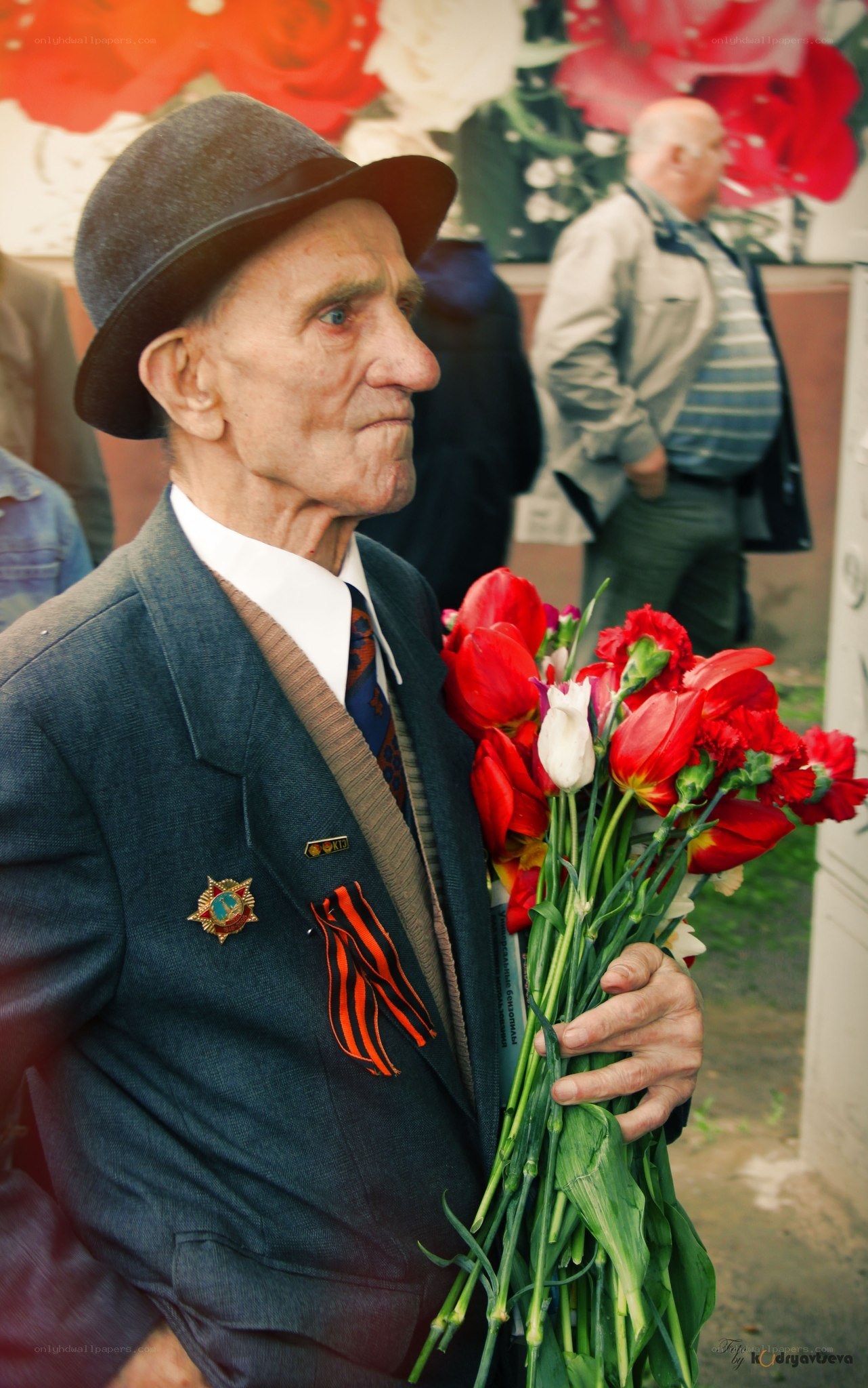 Veteran holding flowers