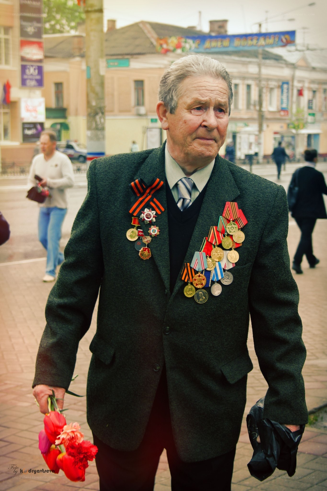 Veteran with medals on street