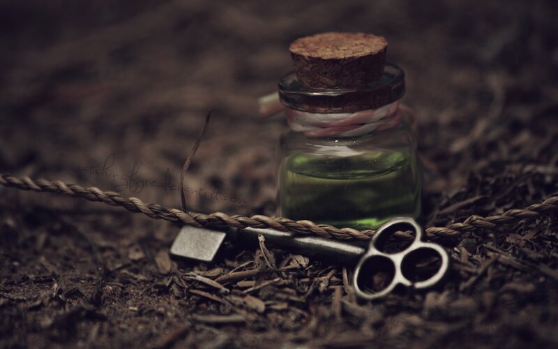 vial and key on ground
