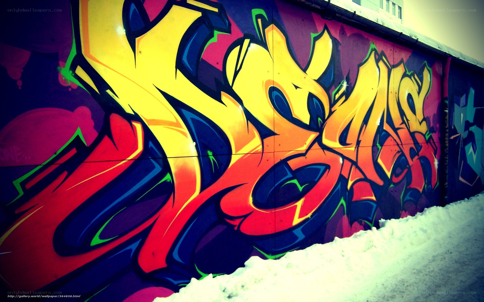 vibrant graffiti on snowy wall