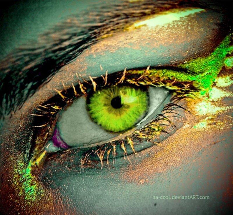 vibrant green eye with artistic makeup