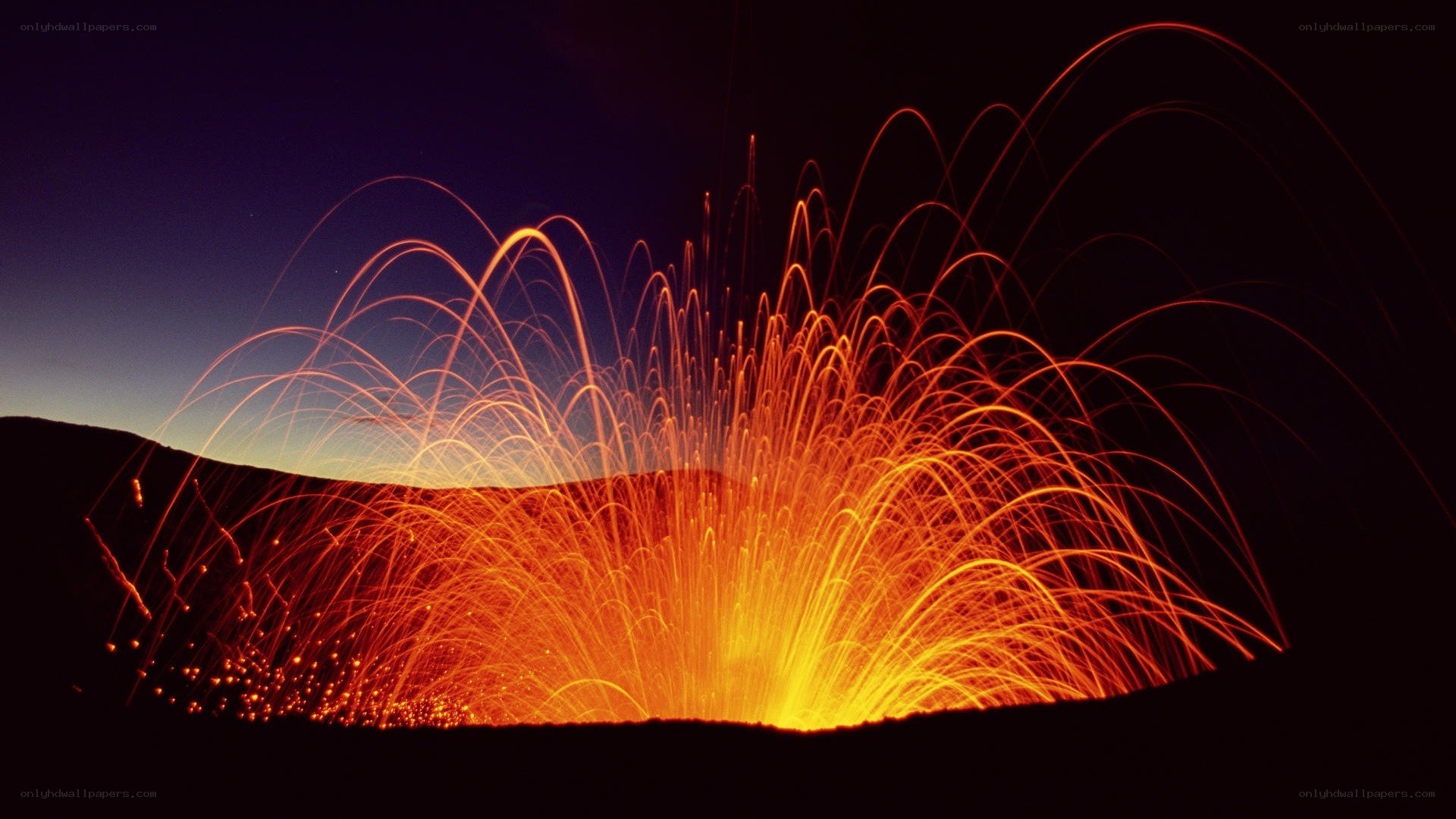 Vibrant light trails on dark hill
