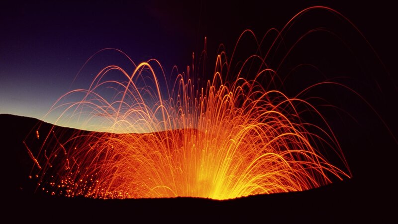 Vibrant light trails on dark hill