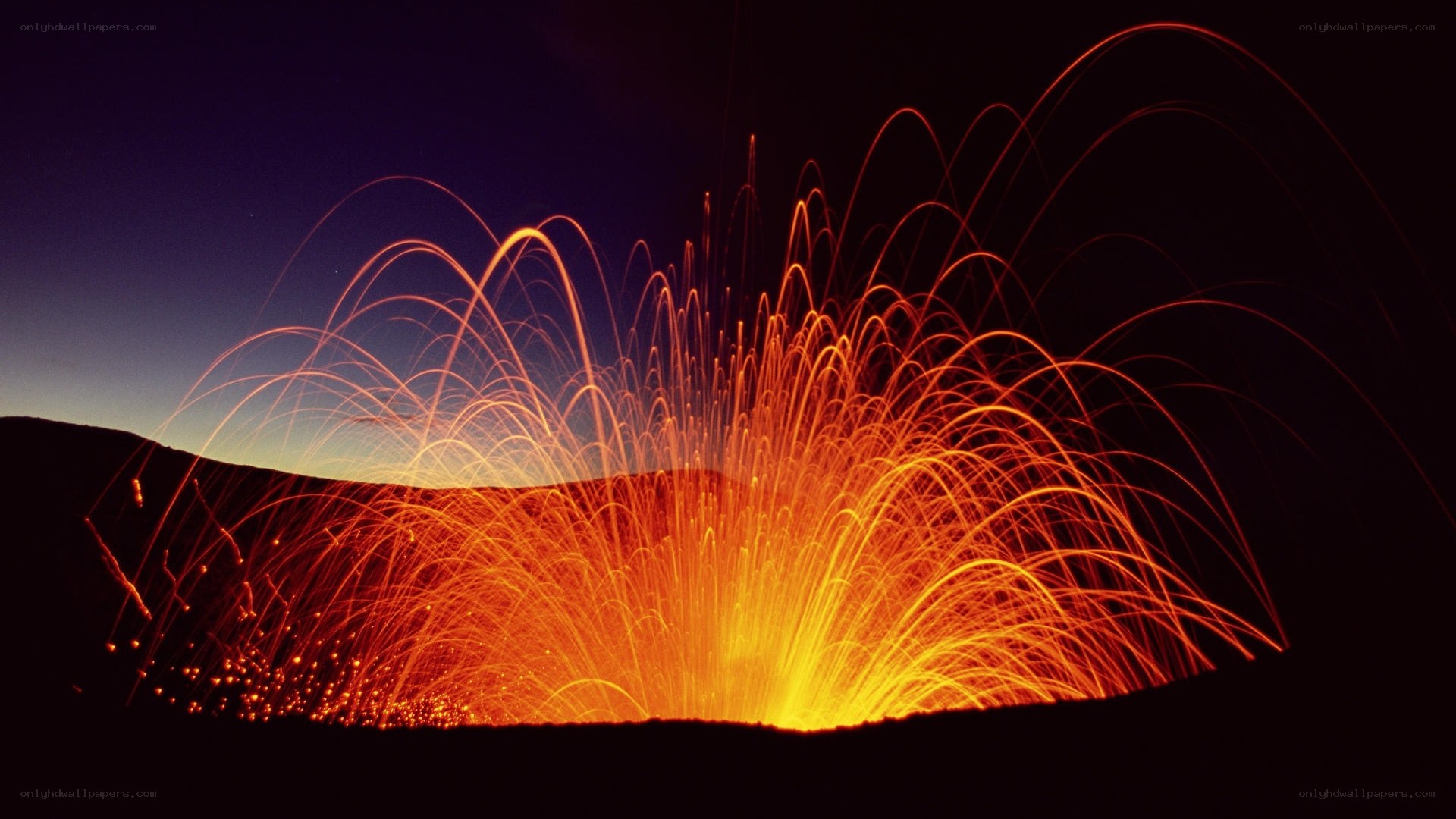 Vibrant light trails on dark hill