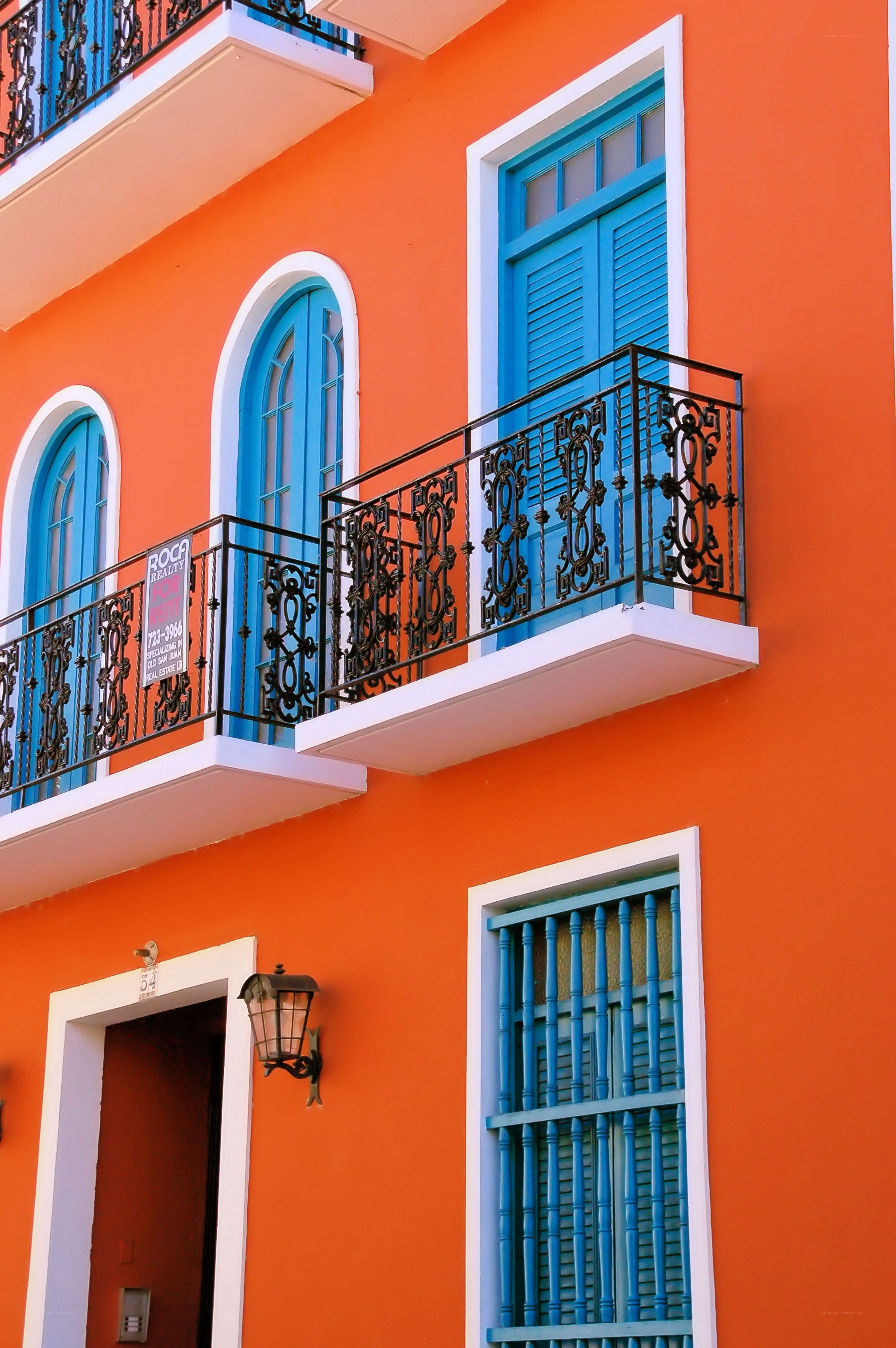 vibrant orange building with blue windows