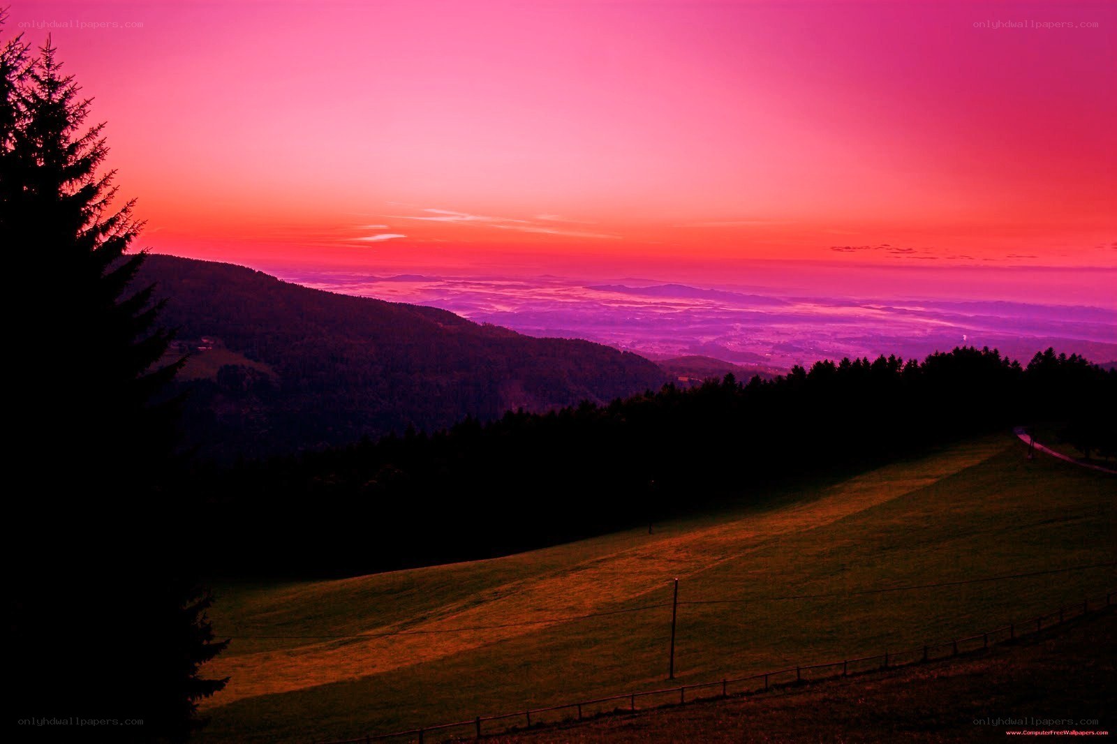 vibrant pink sunset over hills