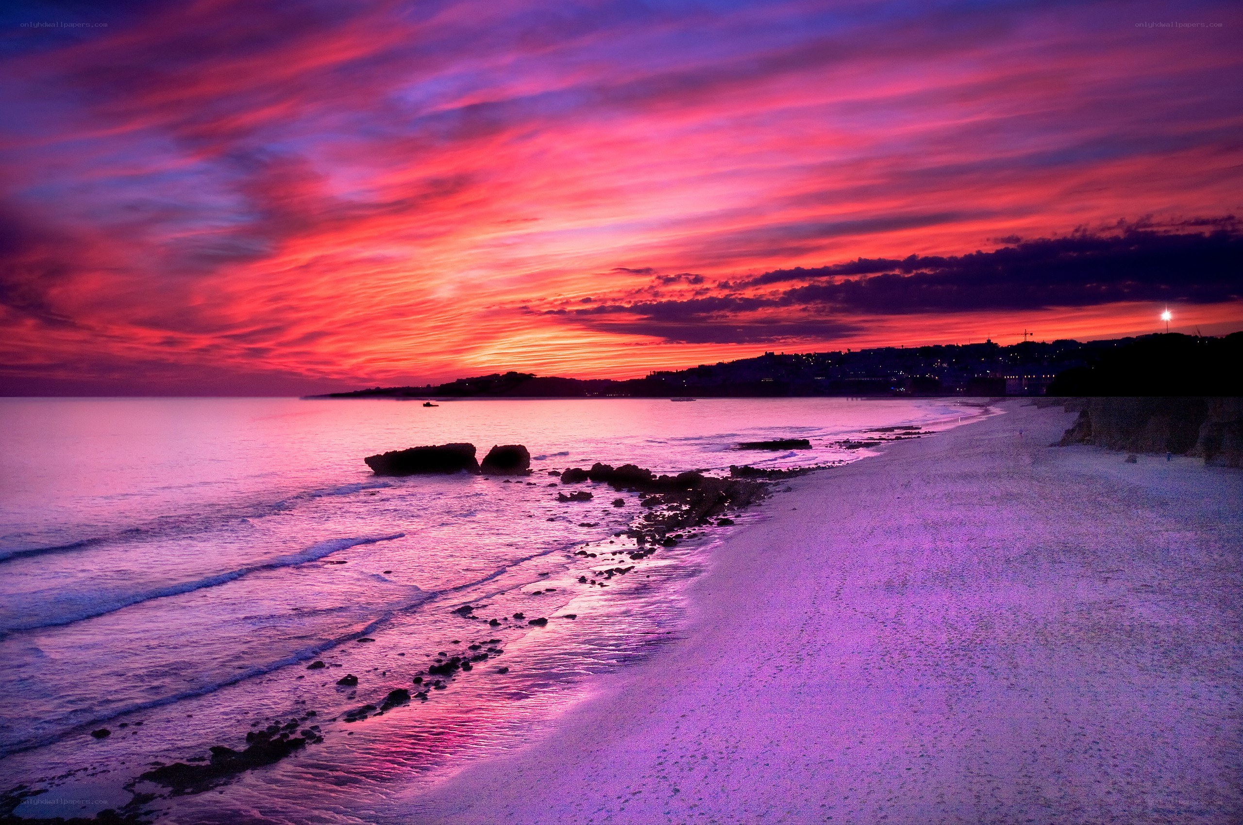 Vibrant purple sunset over beach