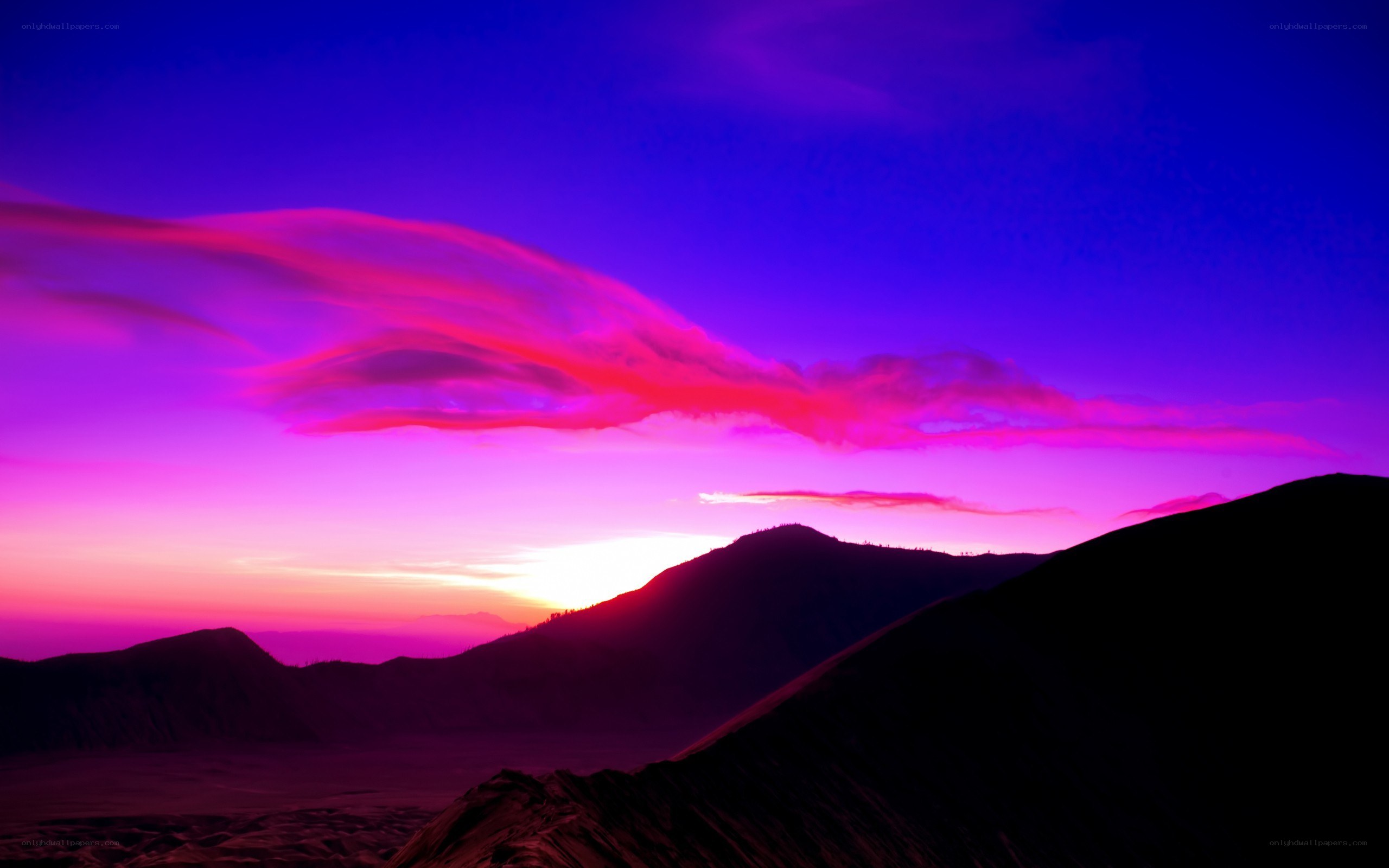 Vibrant purple sunset over mountains