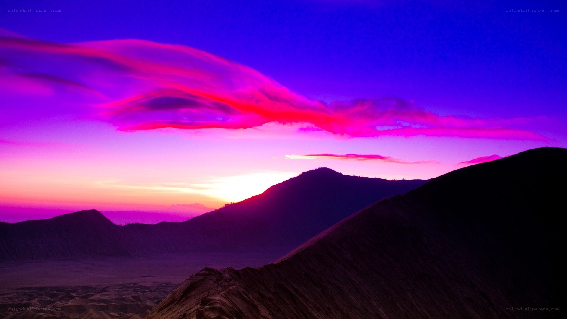 Vibrant purple sunset over mountains