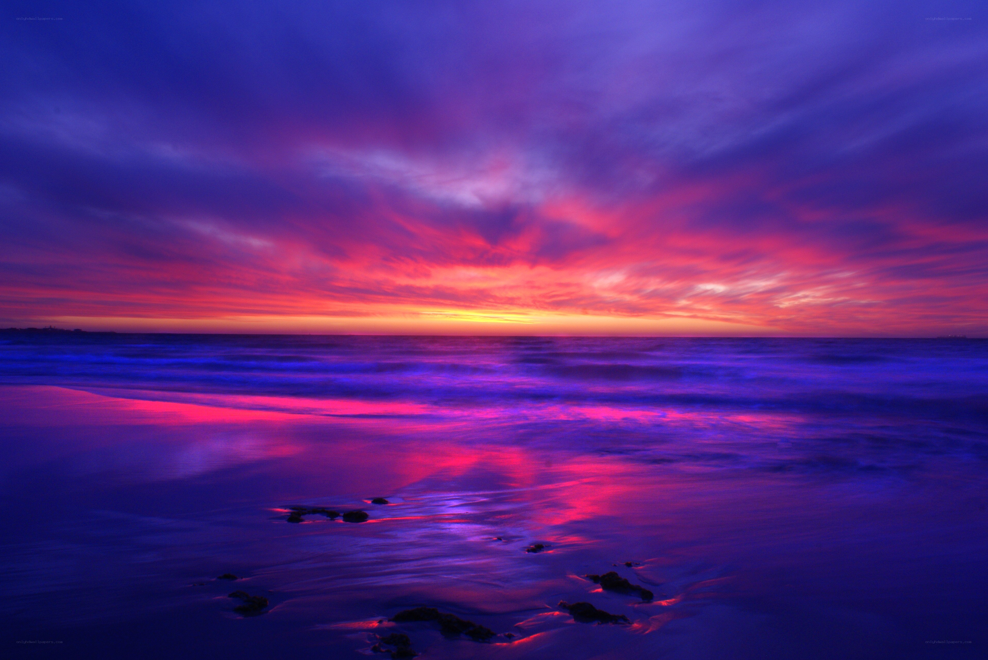 Vibrant purple sunset over ocean