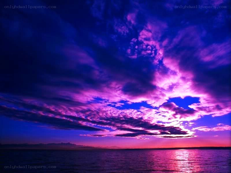 Vibrant purple sunset over water