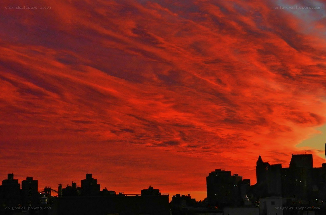 vibrant red sunset over city