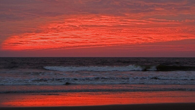 vibrant red sunset over ocean