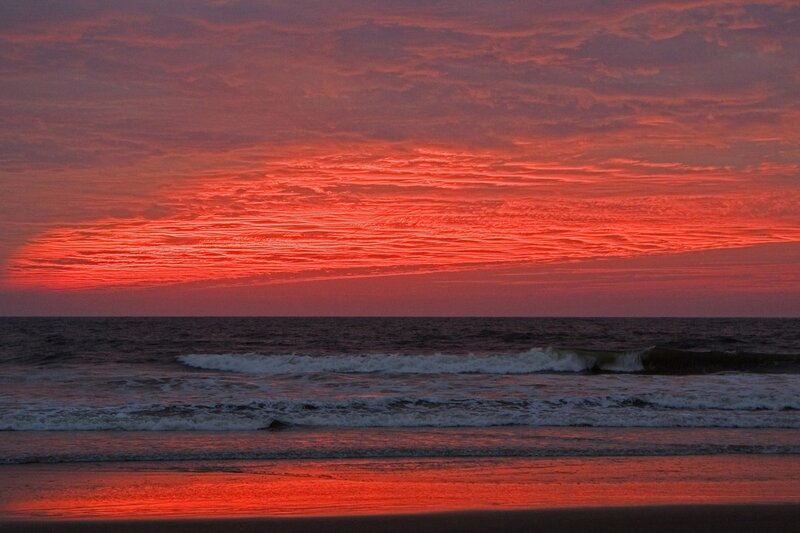 Vibrant red sunset over ocean
