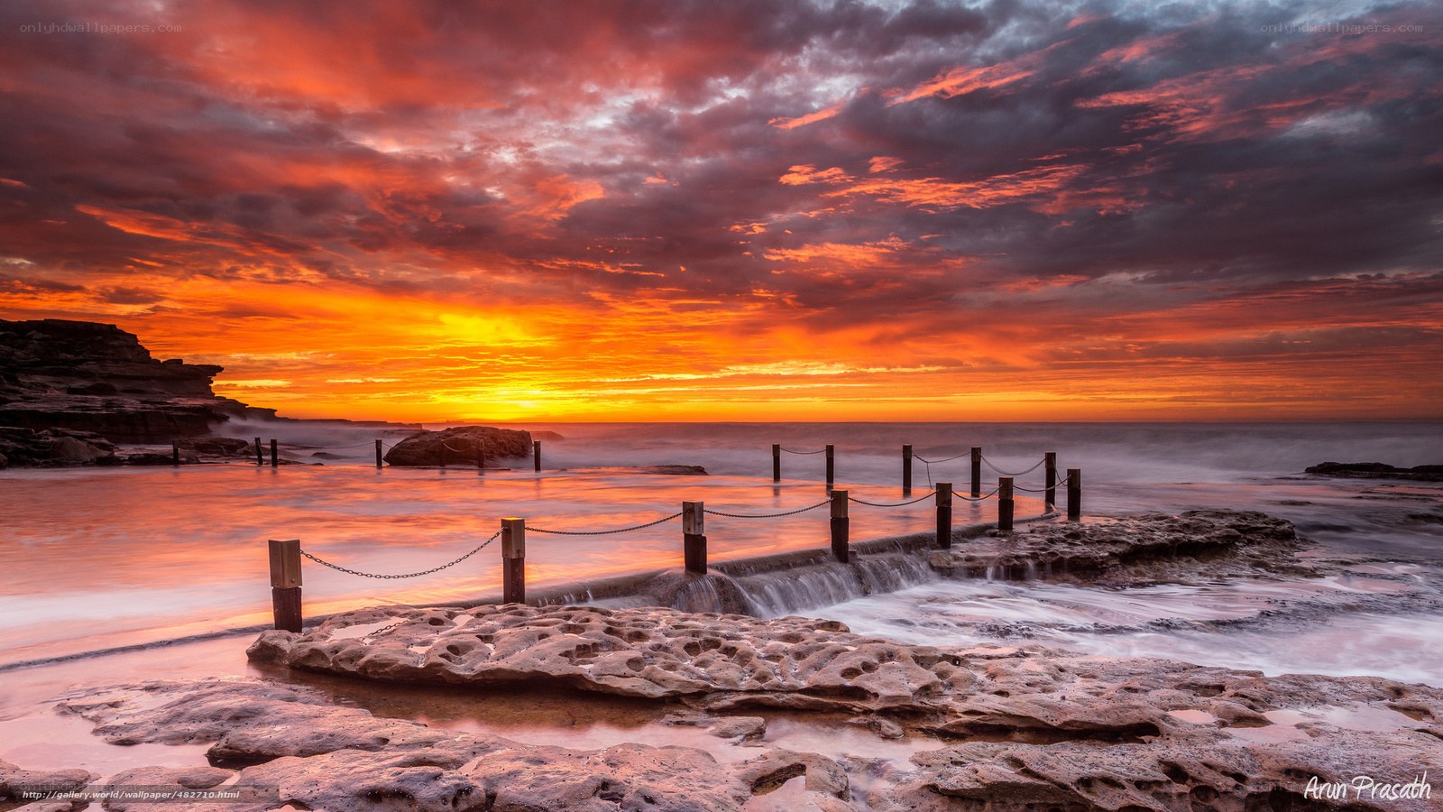 Vibrant sunset at coastal pool