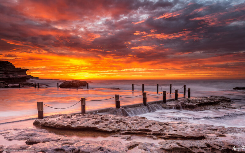 Vibrant sunset at coastal rocks