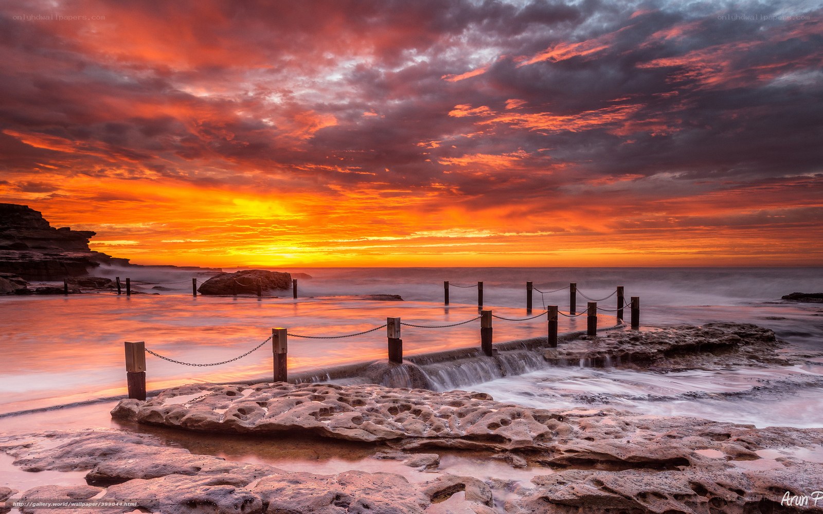 Vibrant sunset at coastal rocks