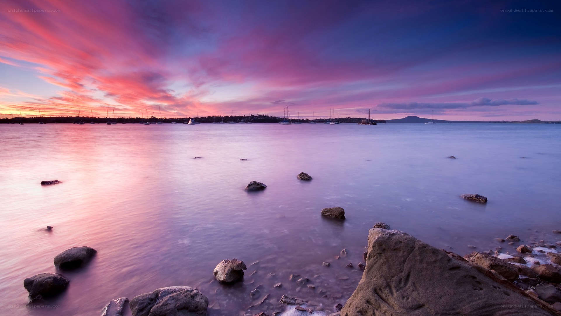 Vibrant sunset over a calm bay